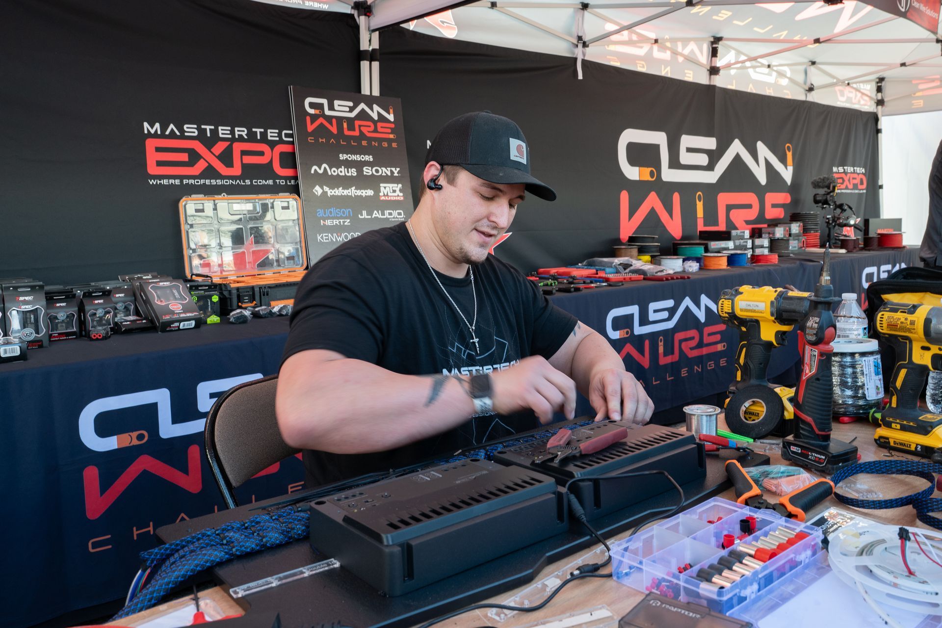 Man at a booth labeled 