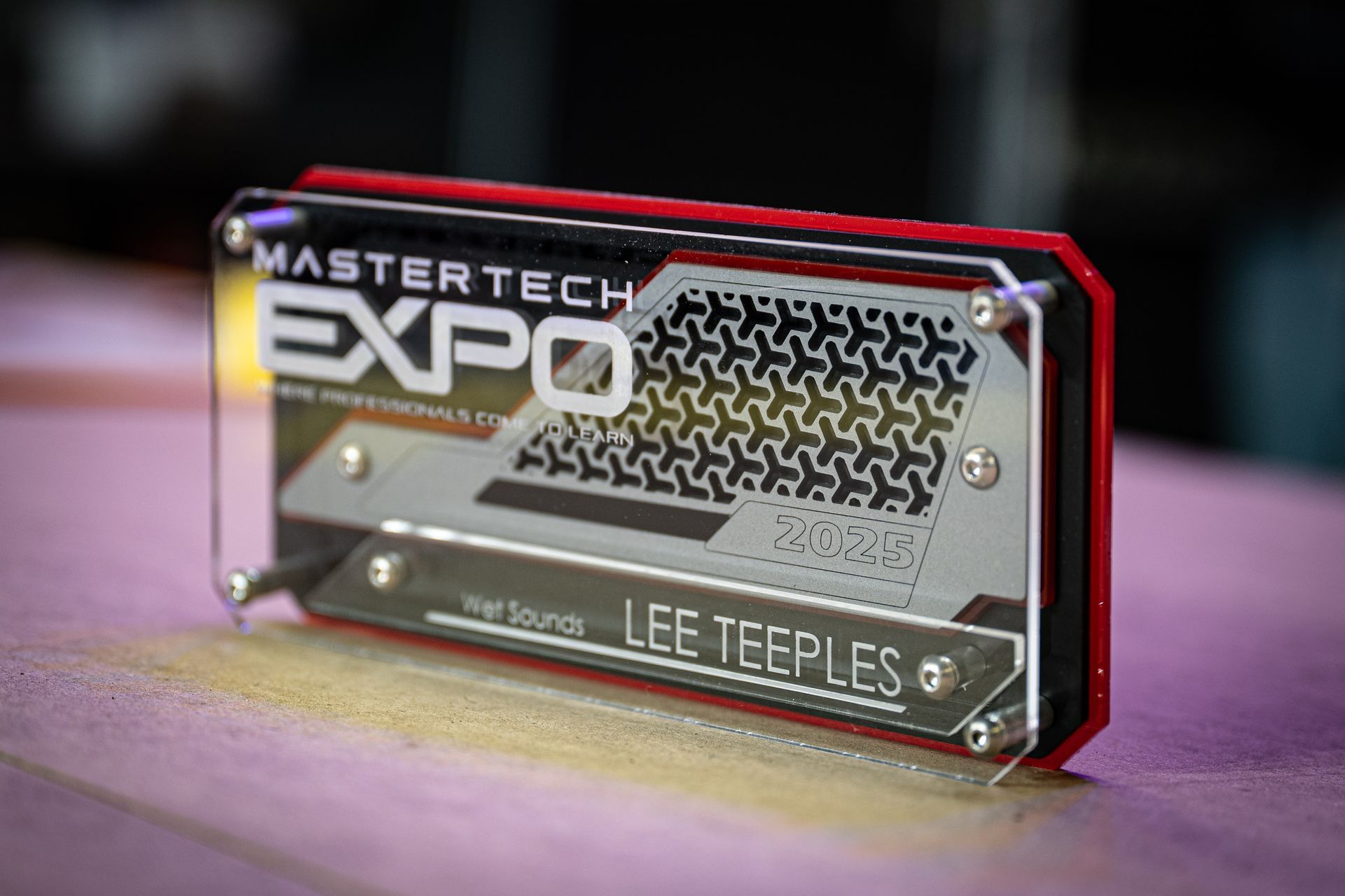 MasterTech Expo name badge with red frame and silver accents, displaying name 