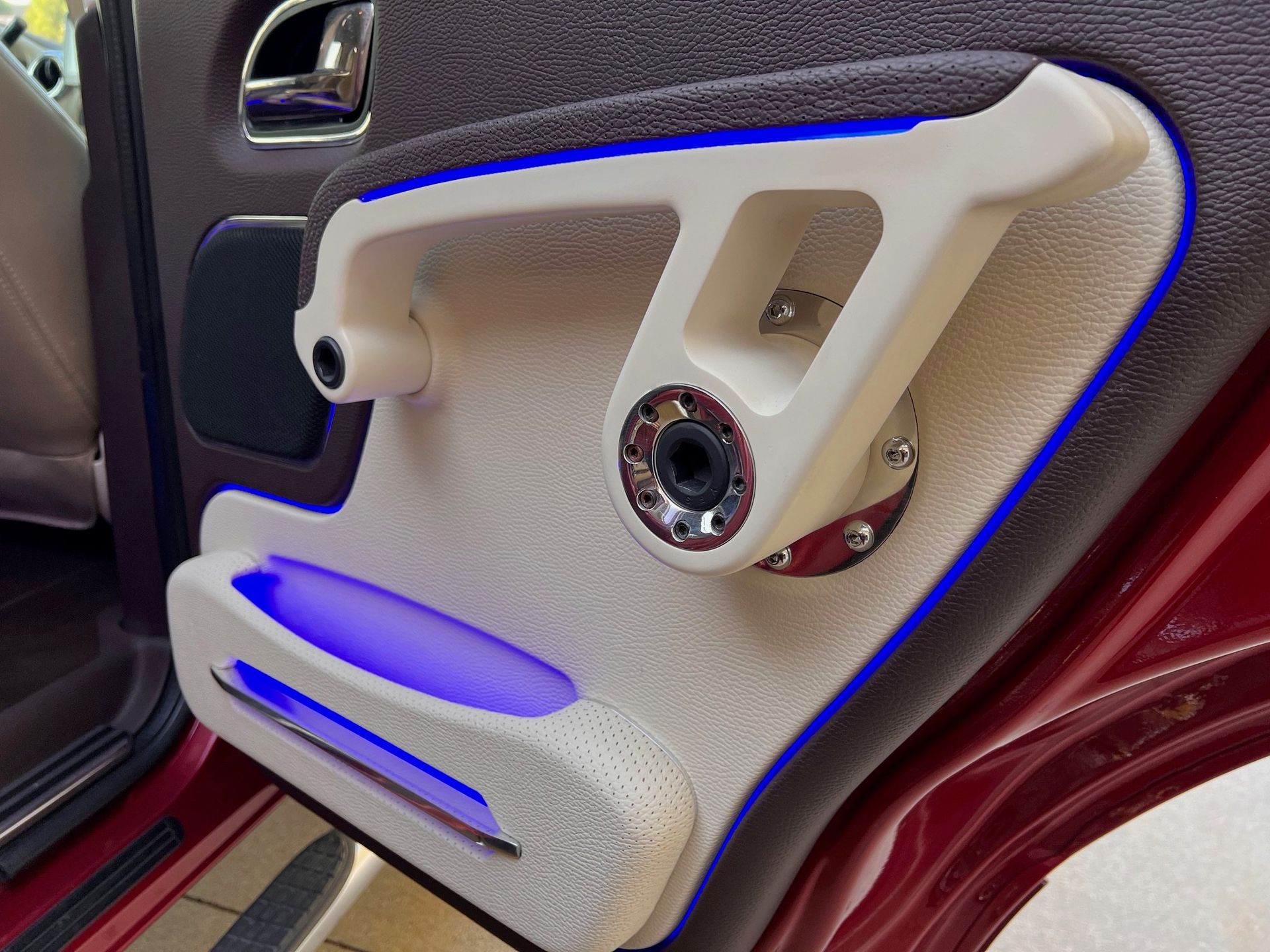 A close up of a car door with a speaker on it