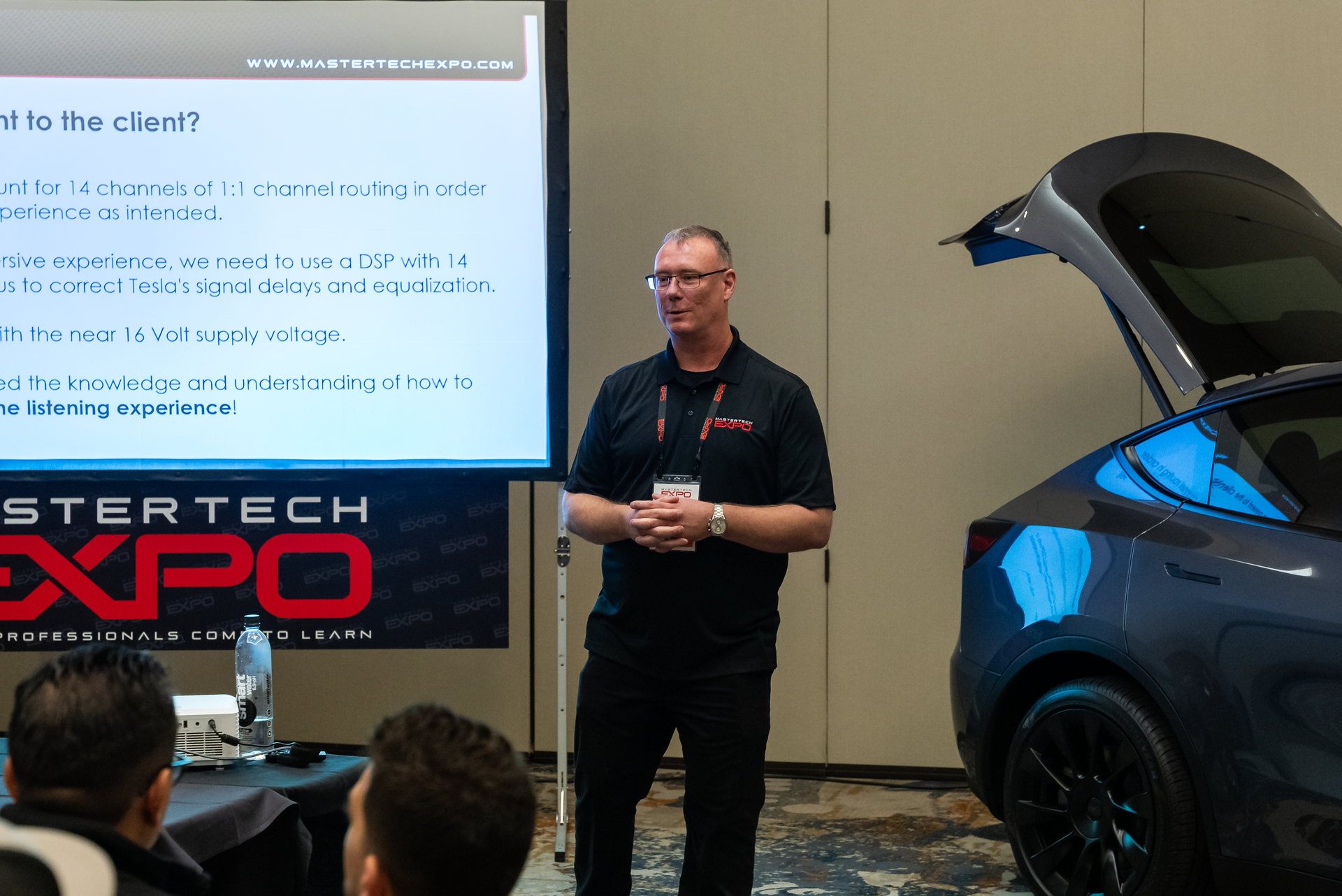 A man is giving a presentation at the stertech expo