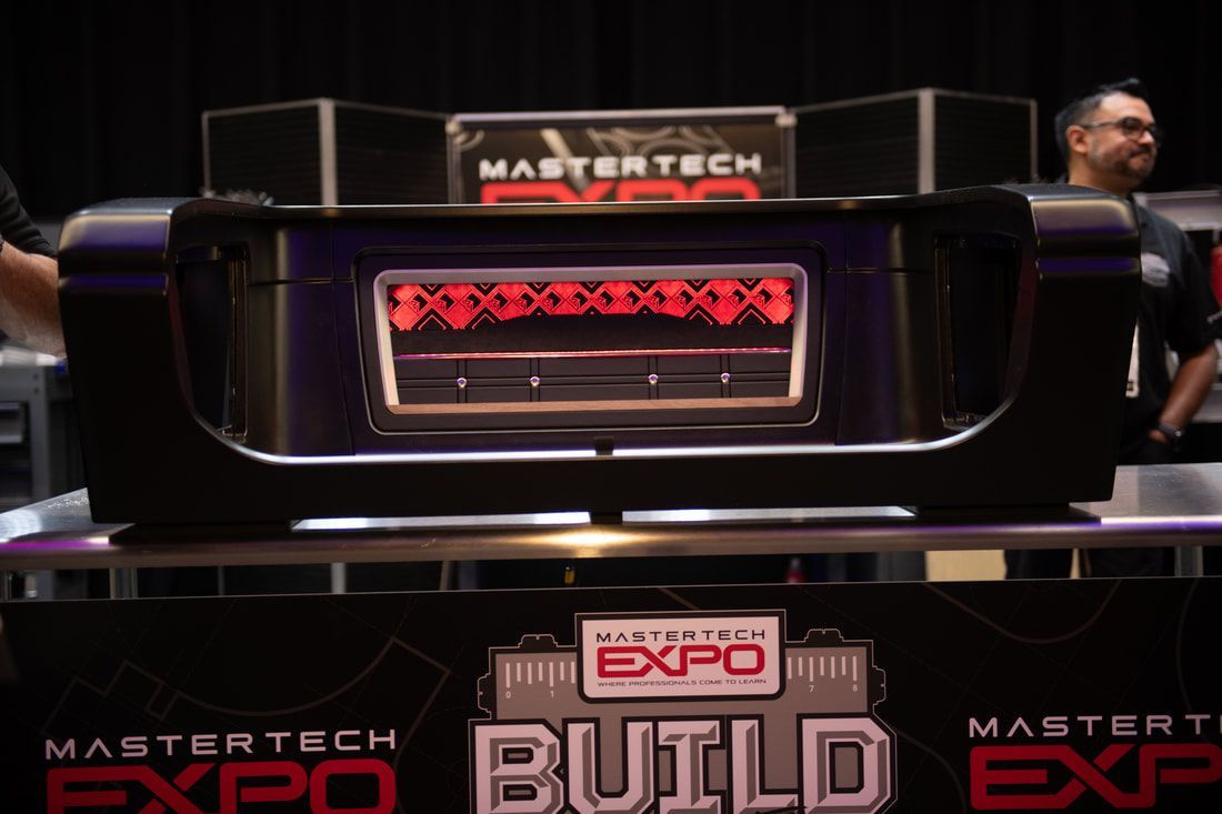 A mastertech expo sign that says build on it