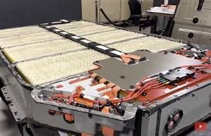 A large battery is sitting on top of a table in a room.