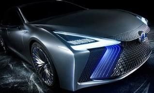 A close up of a silver car with a blue light on the front.