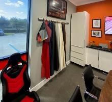 There are many different types of leather hanging on the wall in this room.