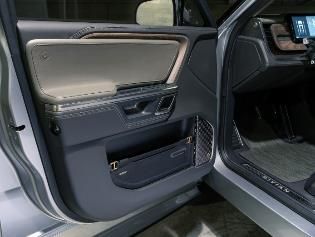 A close up of a car door with the door open.