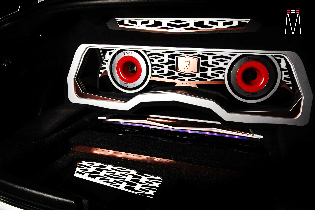 A black car with a subwoofer in the trunk