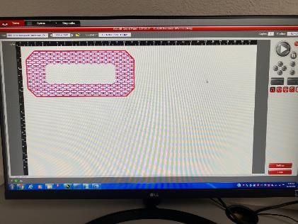 A computer monitor with a drawing of a rectangle on it