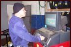 Man Running Diagnostic Test - Muffler Repair Shop in Staten Island, NY
