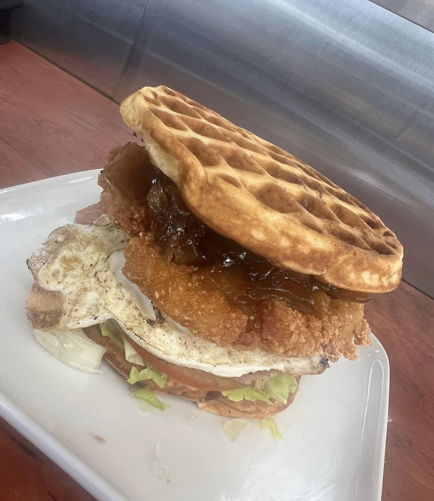 A Waffle Sandwich With Chicken And Eggs On A White Plate — Brownys Wrap and Roll In North Tamworth, NSW