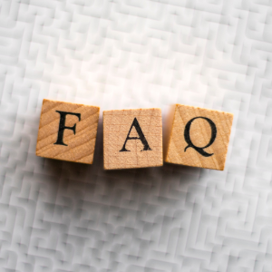 Three wooden blocks with black letters spelling