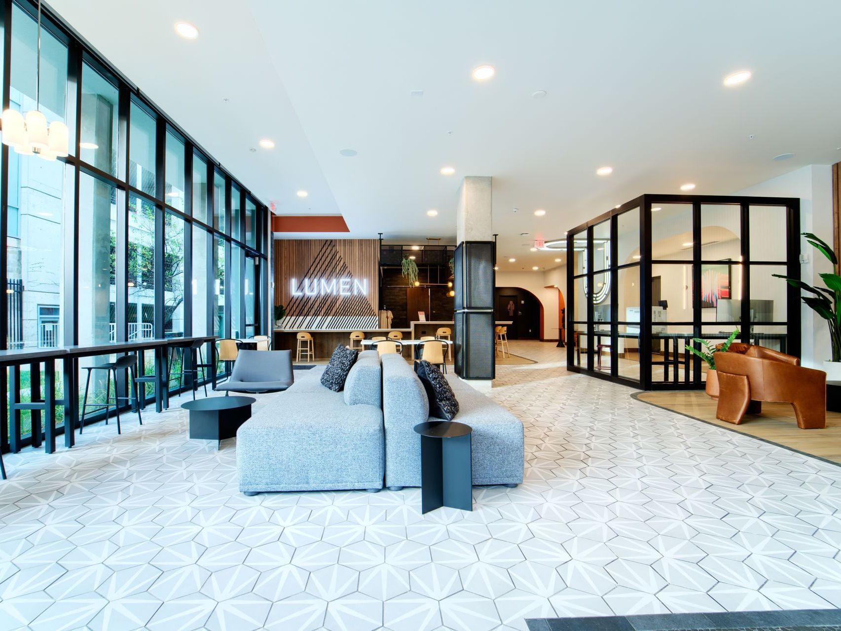 A dental office with a reception desk and a couch in the background.