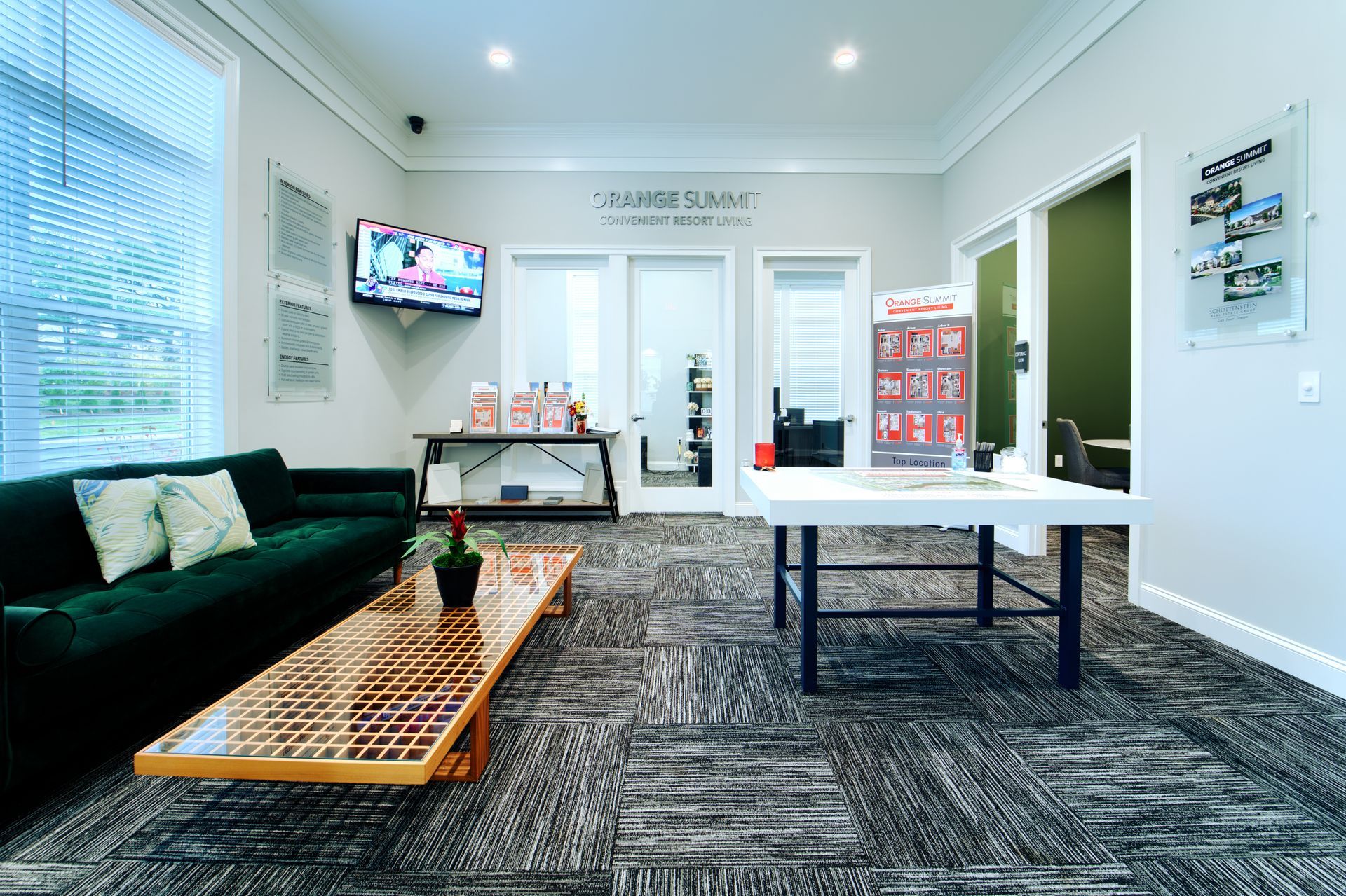 A living room with a couch , table , and television.