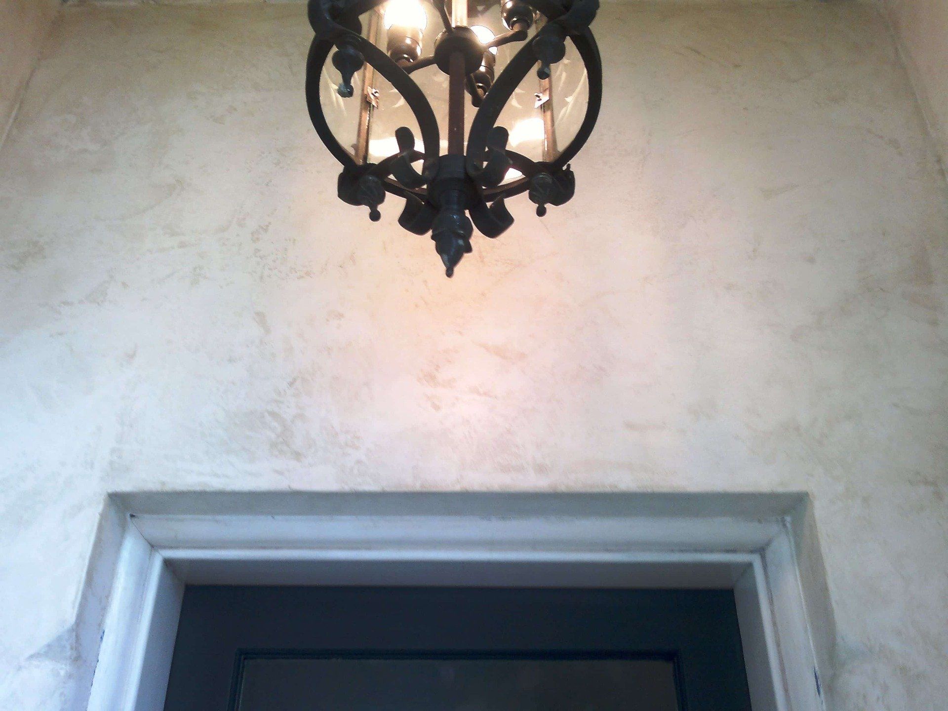 Chandelier Hanging Off Rendered Wall — Gallery in Byron Bay, NSW