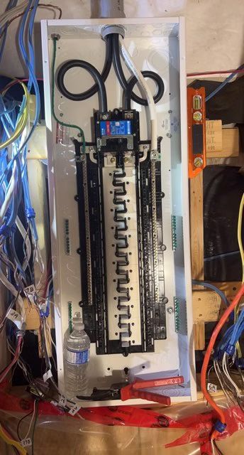 A electrical box is sitting on top of a wooden table.