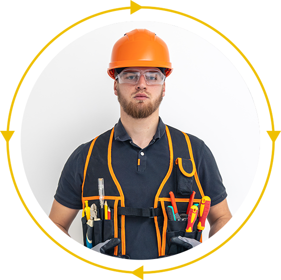 A man wearing a hard hat and safety vest is holding tools.