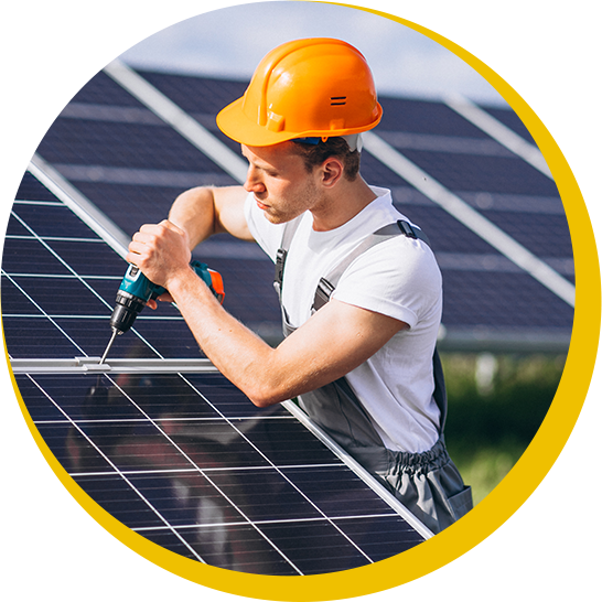 A man wearing an orange hard hat is working on a solar panel