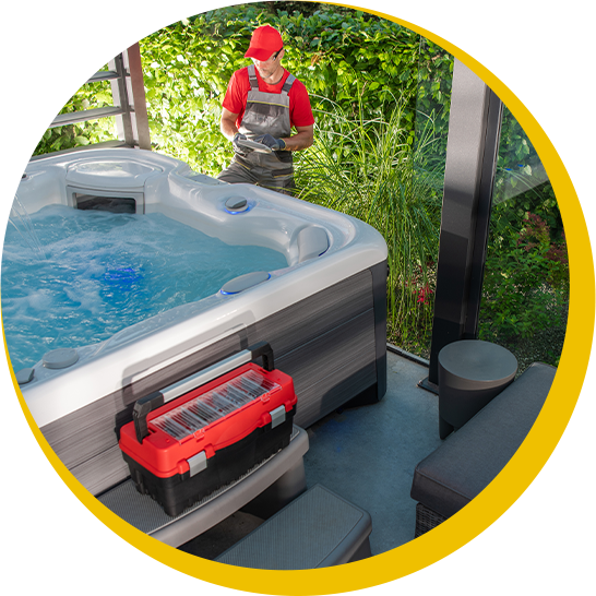 A man standing next to a hot tub with a toolbox in front of it