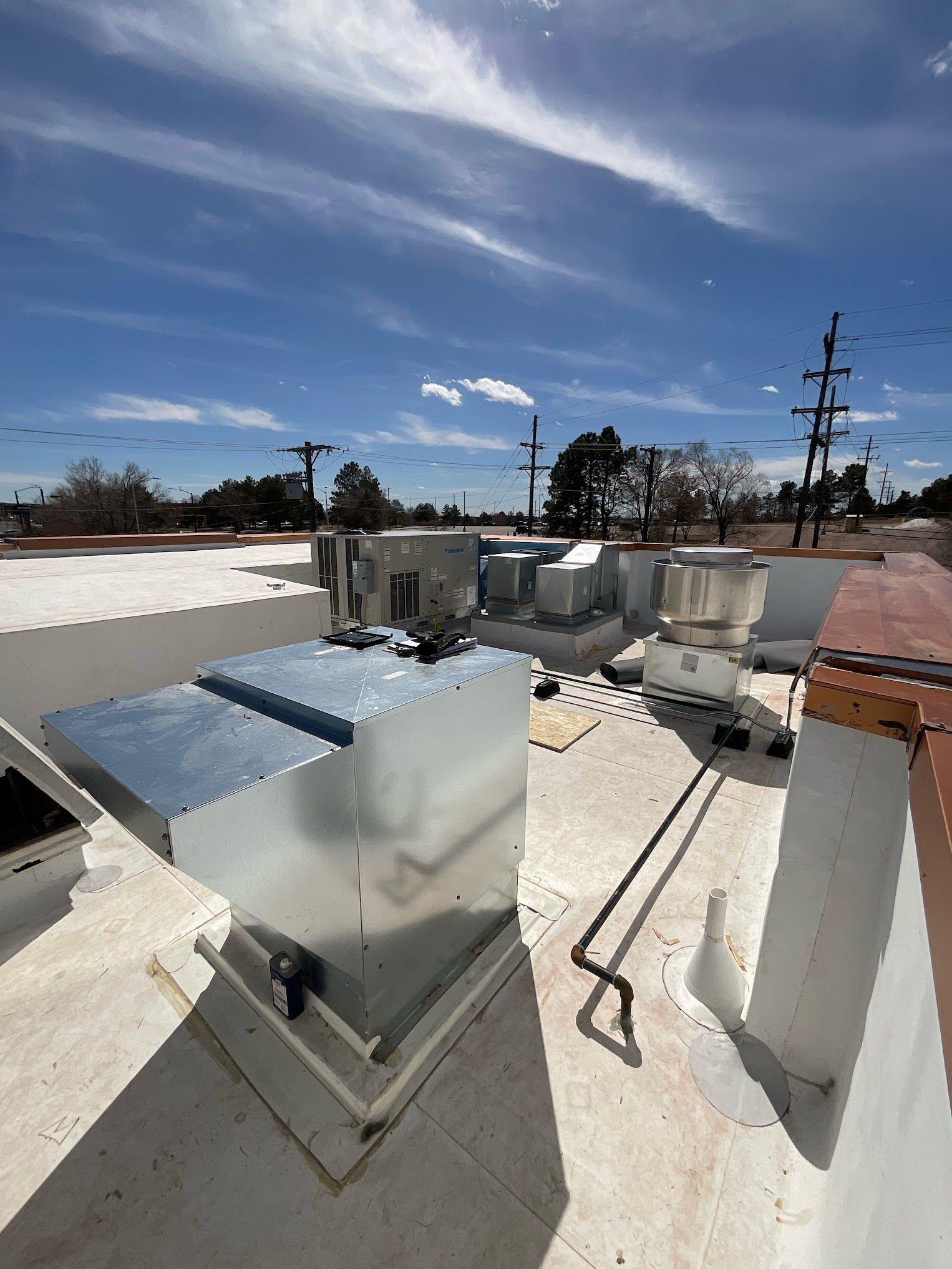 A rooftop with a lot of metal boxes on it