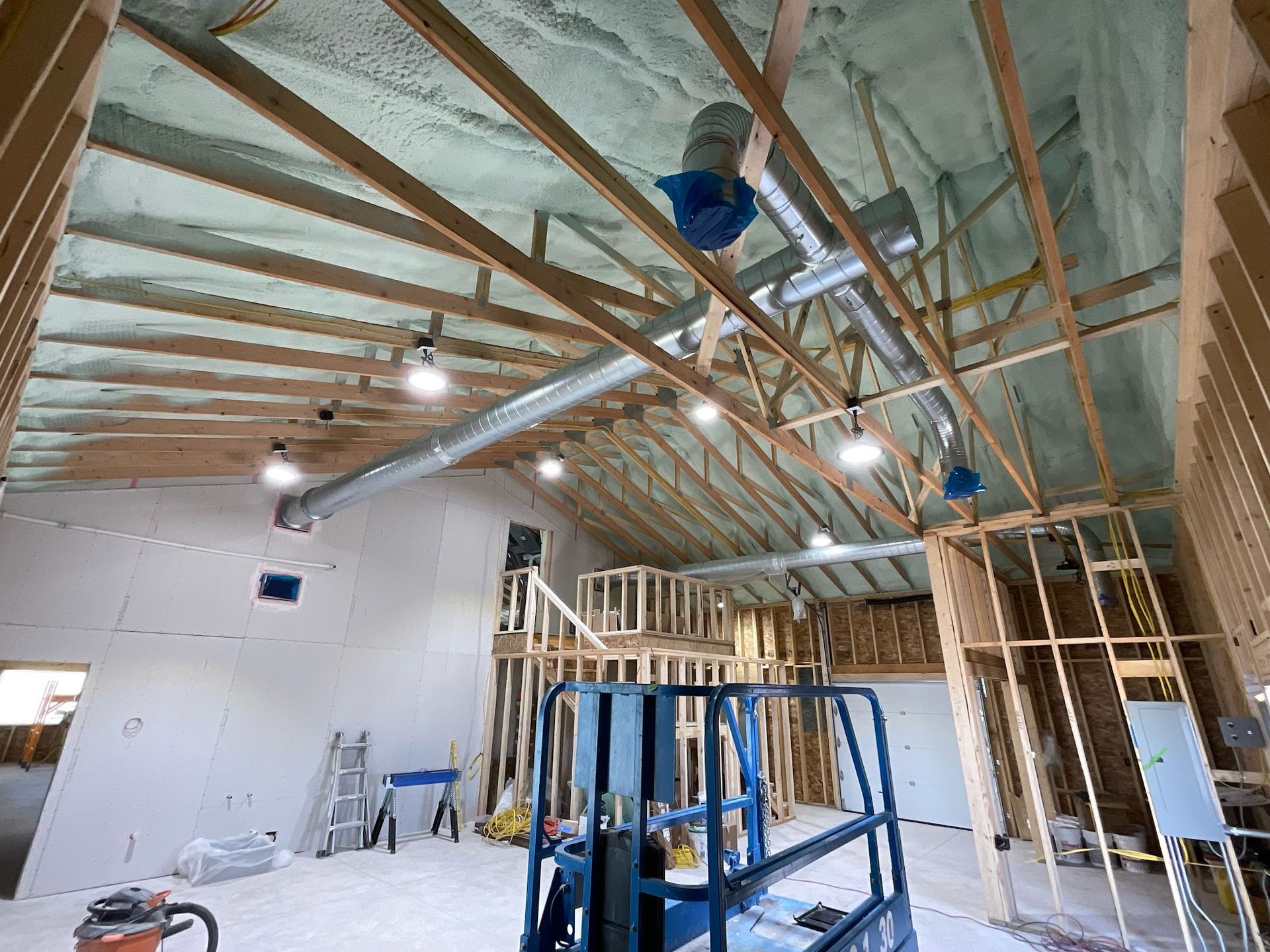 There is a forklift in the middle of the room.