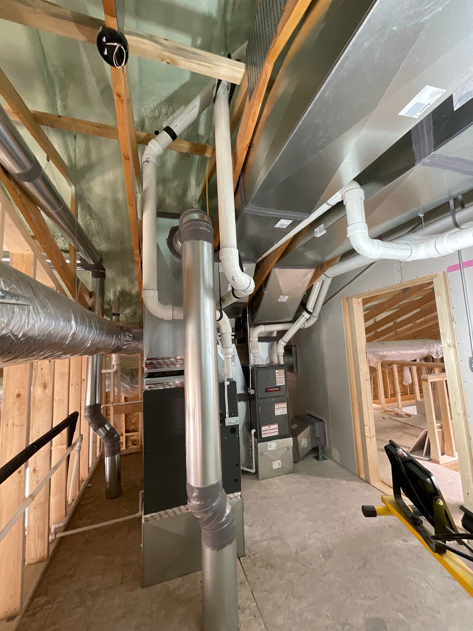 A room with a lot of pipes coming out of the ceiling.