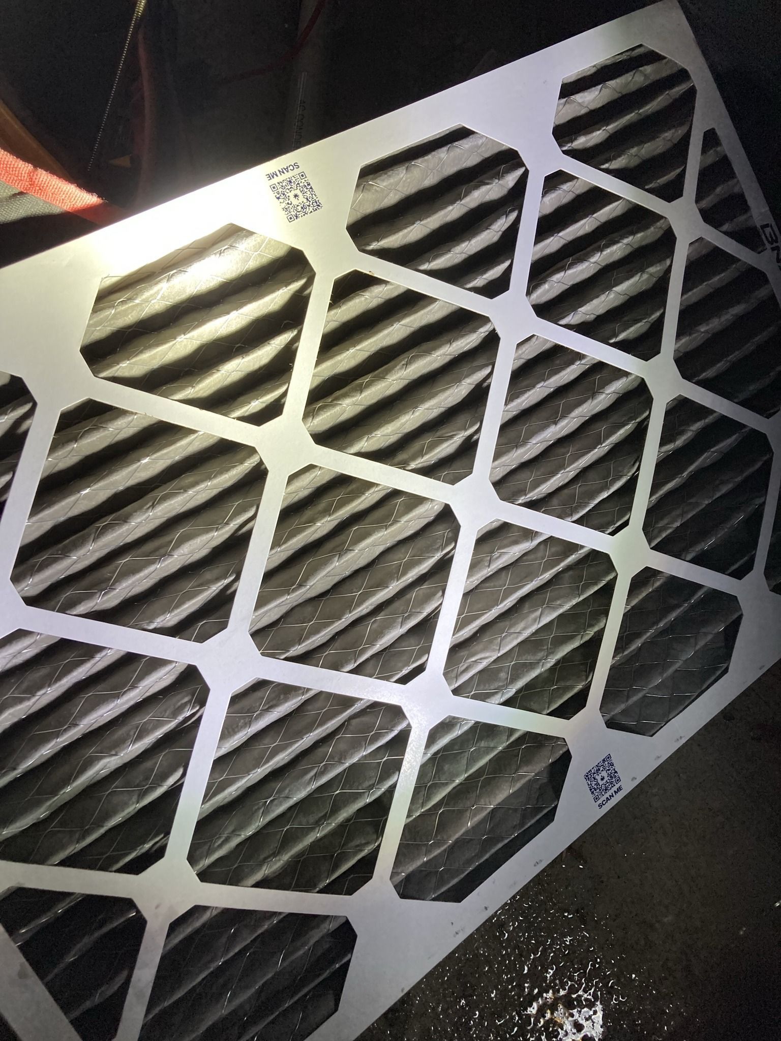 A close up of a piece of metal with holes in it.