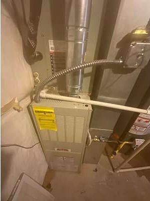 A picture of an air conditioner in a basement.