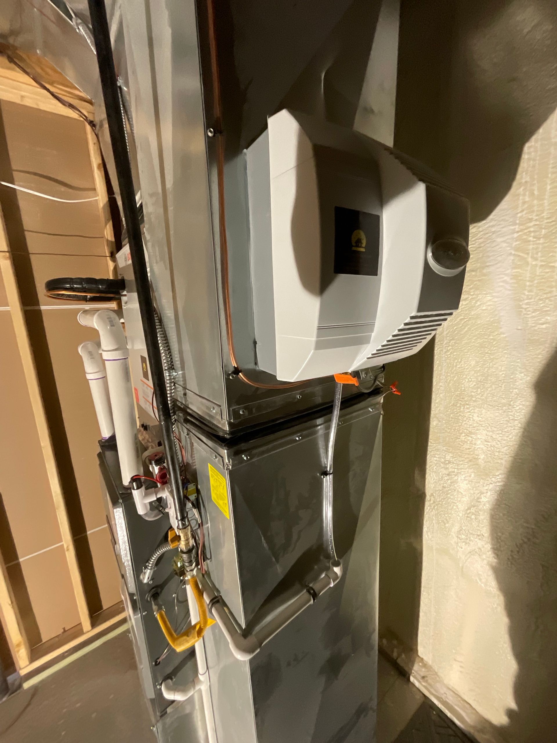 A picture of a heating system in a basement.