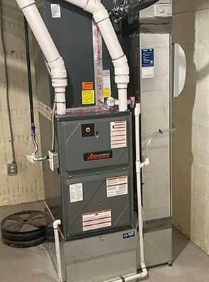 A heating and cooling system is installed in a basement.