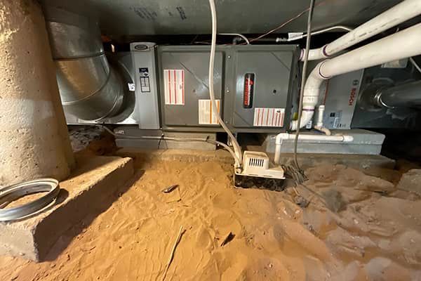 A picture of a furnace in a basement.