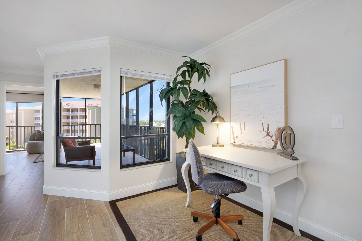 A room with a desk and a chair in it