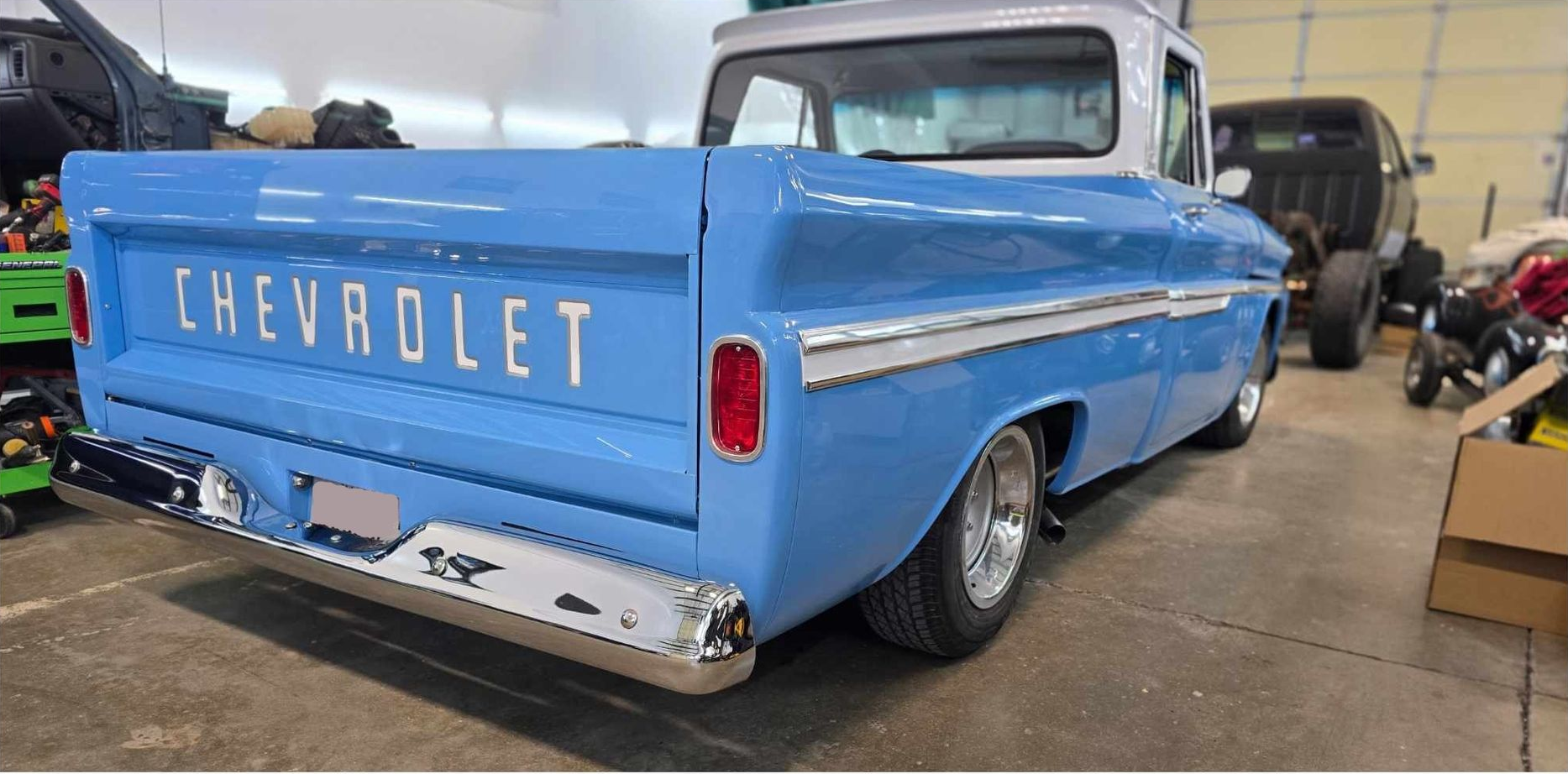 Gray pickup truck parked on asphalt.