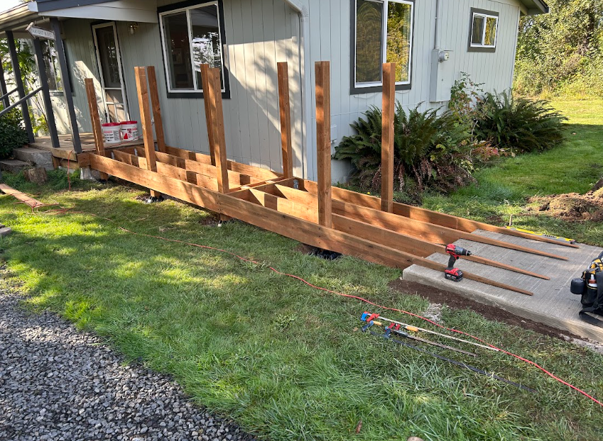 An aerial view of a house with a white fence around it.