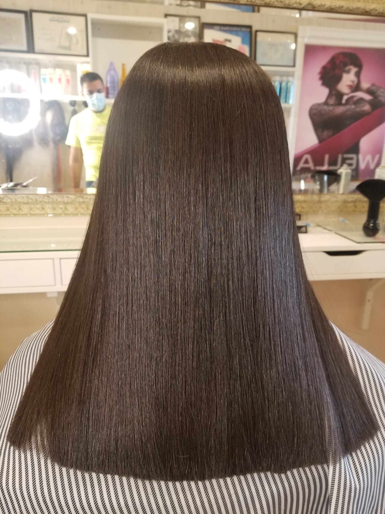 Photograph capturing the process of a luxurious Crystal Treatment, featuring the application of nourishing products and innovative techniques to promote hair health and vitality, emblematic of the salon's commitment to premium hair care services.