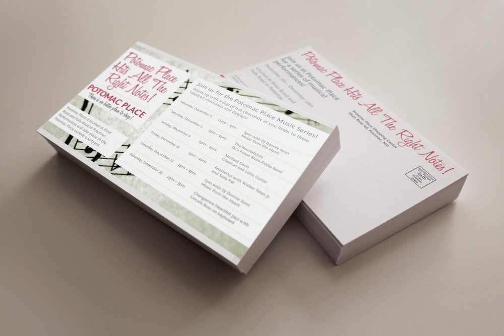 Two cards are stacked on top of each other on a table.