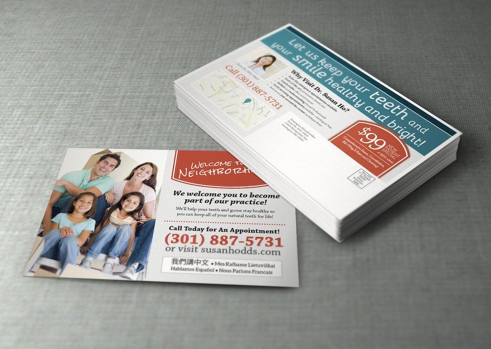A stack of business cards for a dental office