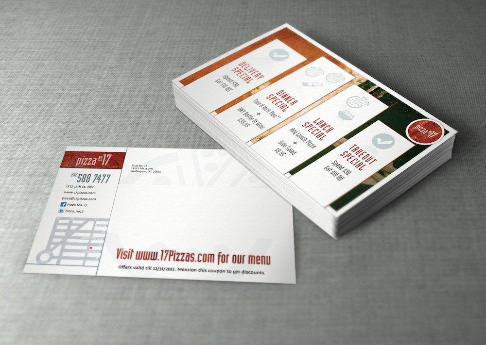 A stack of business cards and envelopes for pizza hut