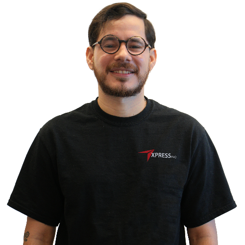 A man wearing glasses and a black xpress t-shirt