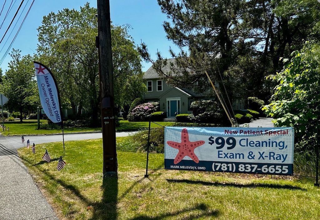 A sign that says $ 99 cleaning exam and x-ray