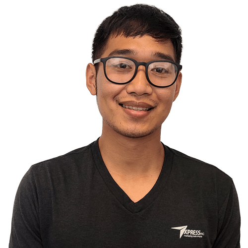 A man wearing glasses and a black shirt is smiling for the camera.