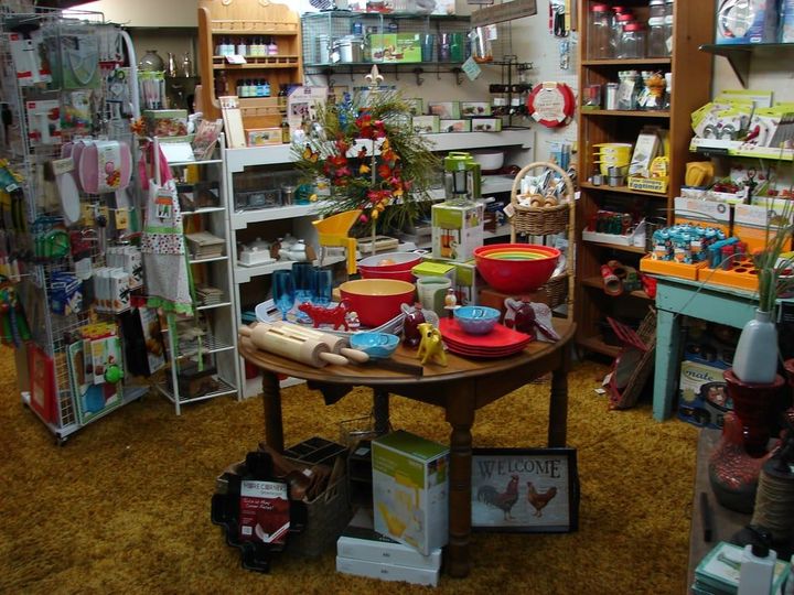 A table in a store with a sign that says welcome