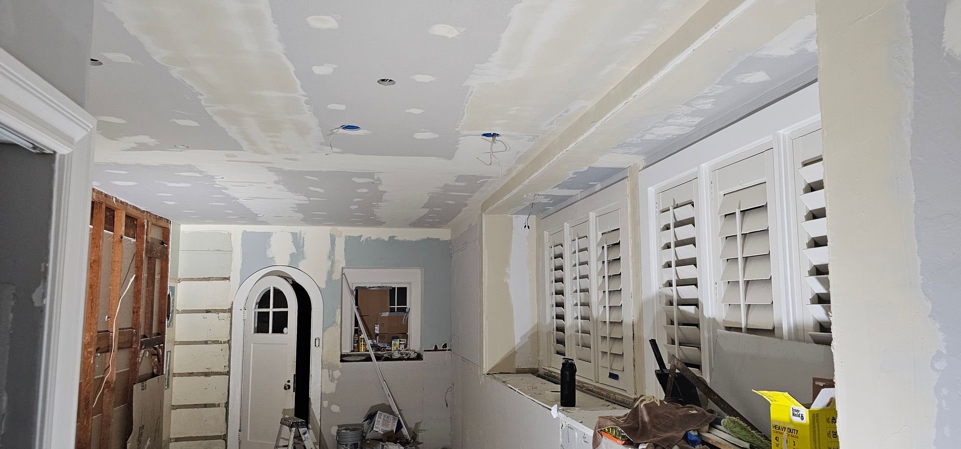 A room with a ceiling that is being remodeled.