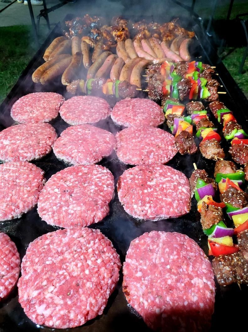Hamburgers , Sausages , and Skewers Are Cooking on a Grill — Multy Cut Meats In Yorkeys Knob, QLD