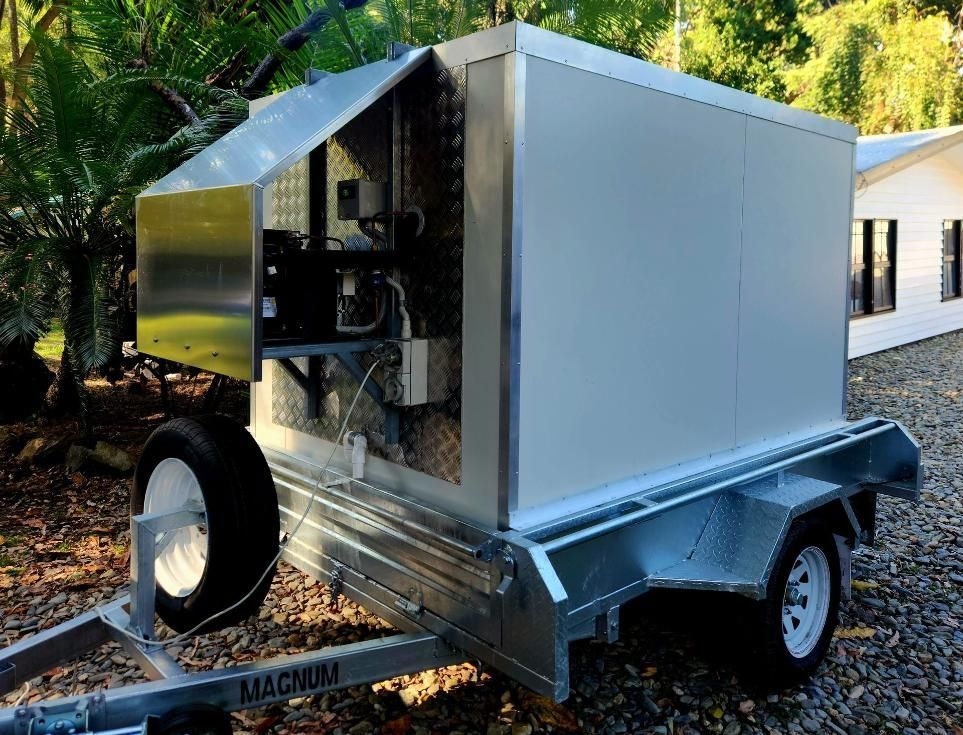 A Magnum Trailer is Parked in Front of a House — Multy Cut Meats In Yorkeys Knob, QLD
