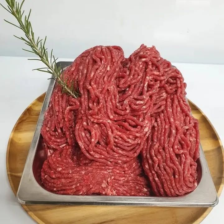 A Tray of Ground Beef With a Sprig of Rosemary on Top — Multy Cut Meats In Yorkeys Knob, QLD