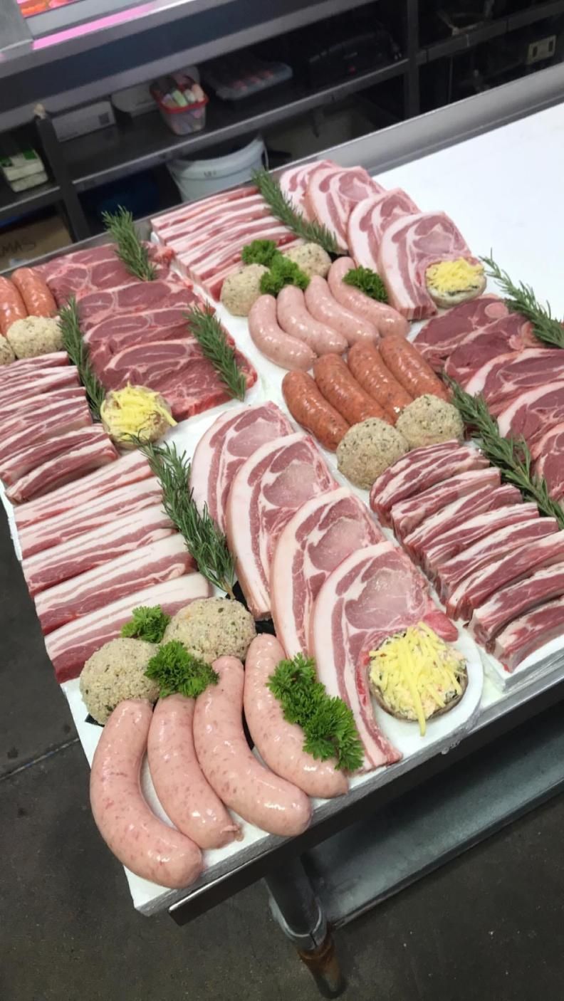 A large tray of meat and sausages on a table — Multy Cut Meats In Yorkeys Knob, QLD