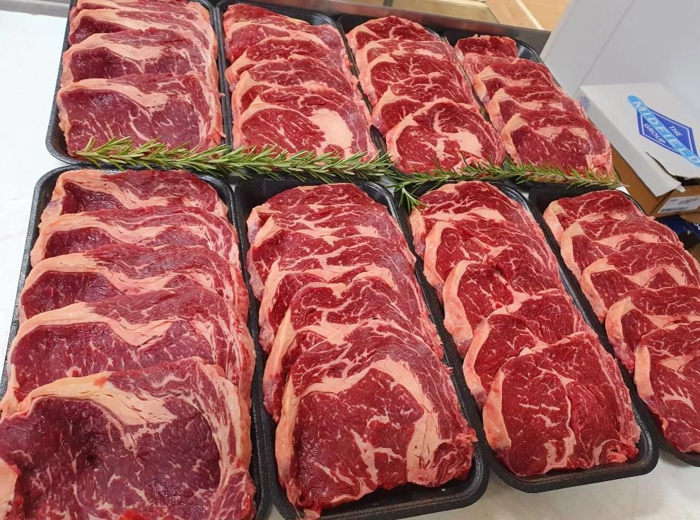 A Bunch of Steaks Are Sitting on Top of Each Other on a Table — Multy Cut Meats In Yorkeys Knob, QLD