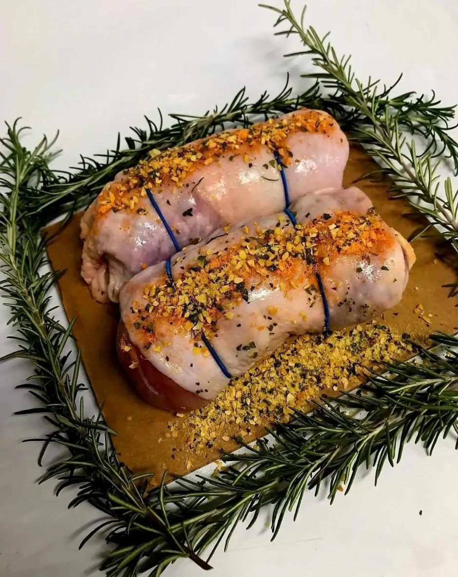A Close Up of a Piece of Meat on a Plate With Rosemary — Multy Cut Meats In Yorkeys Knob, QLD