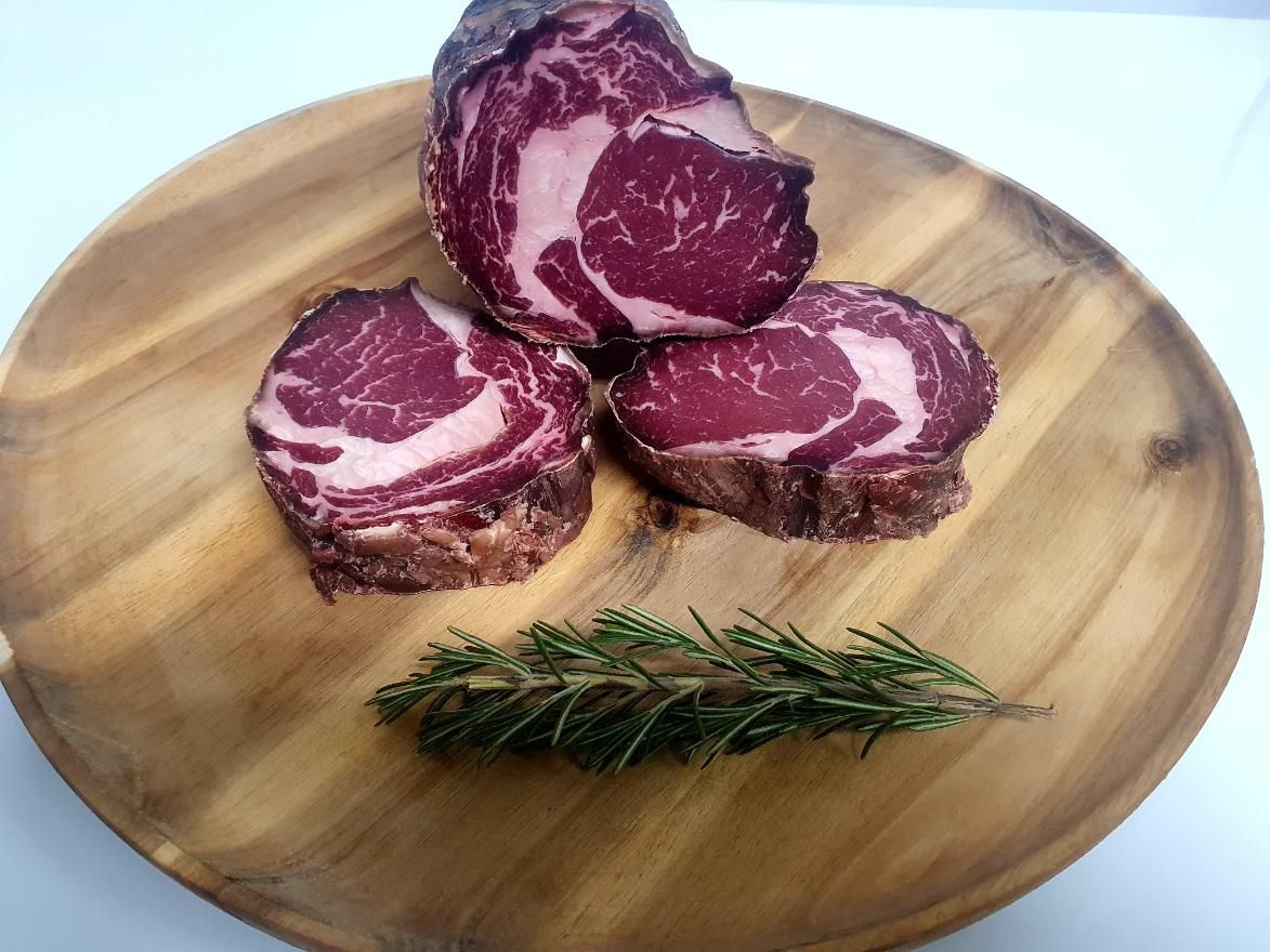 Three Pieces of Meat Are Sitting on a Wooden Cutting Board — Multy Cut Meats In Yorkeys Knob, QLD