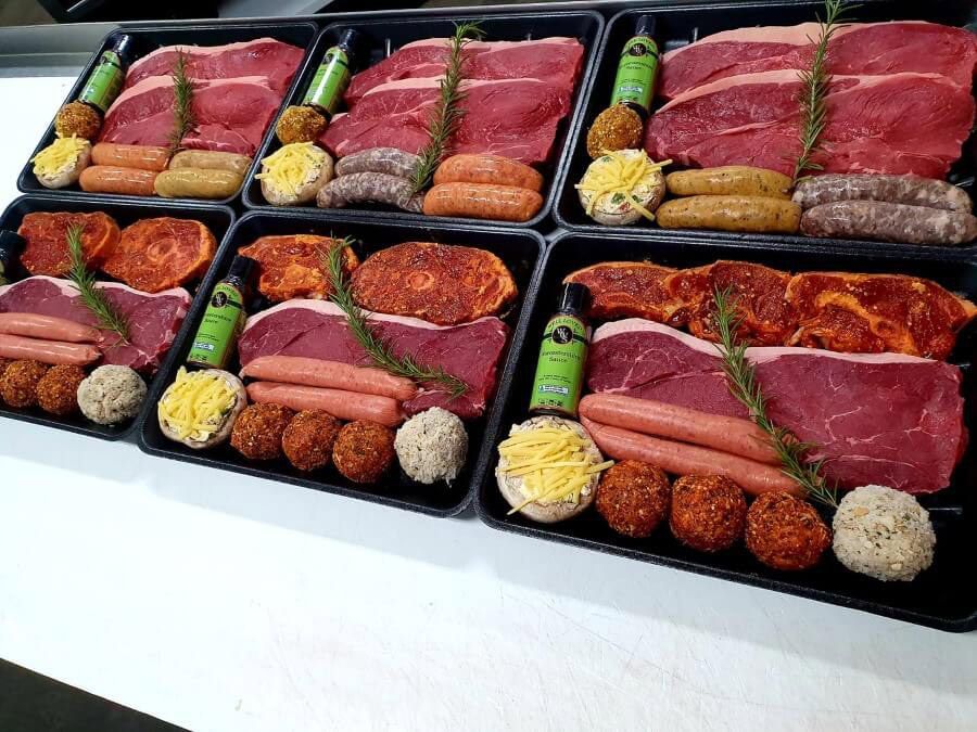 A Bunch of Trays Filled With Meat and Vegetables on a Table — Multy Cut Meats In Yorkeys Knob, QLD