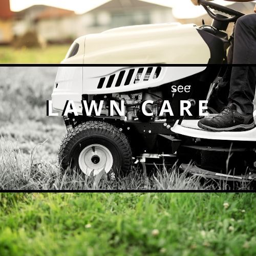 A person rides a white lawn tractor through a field with the text